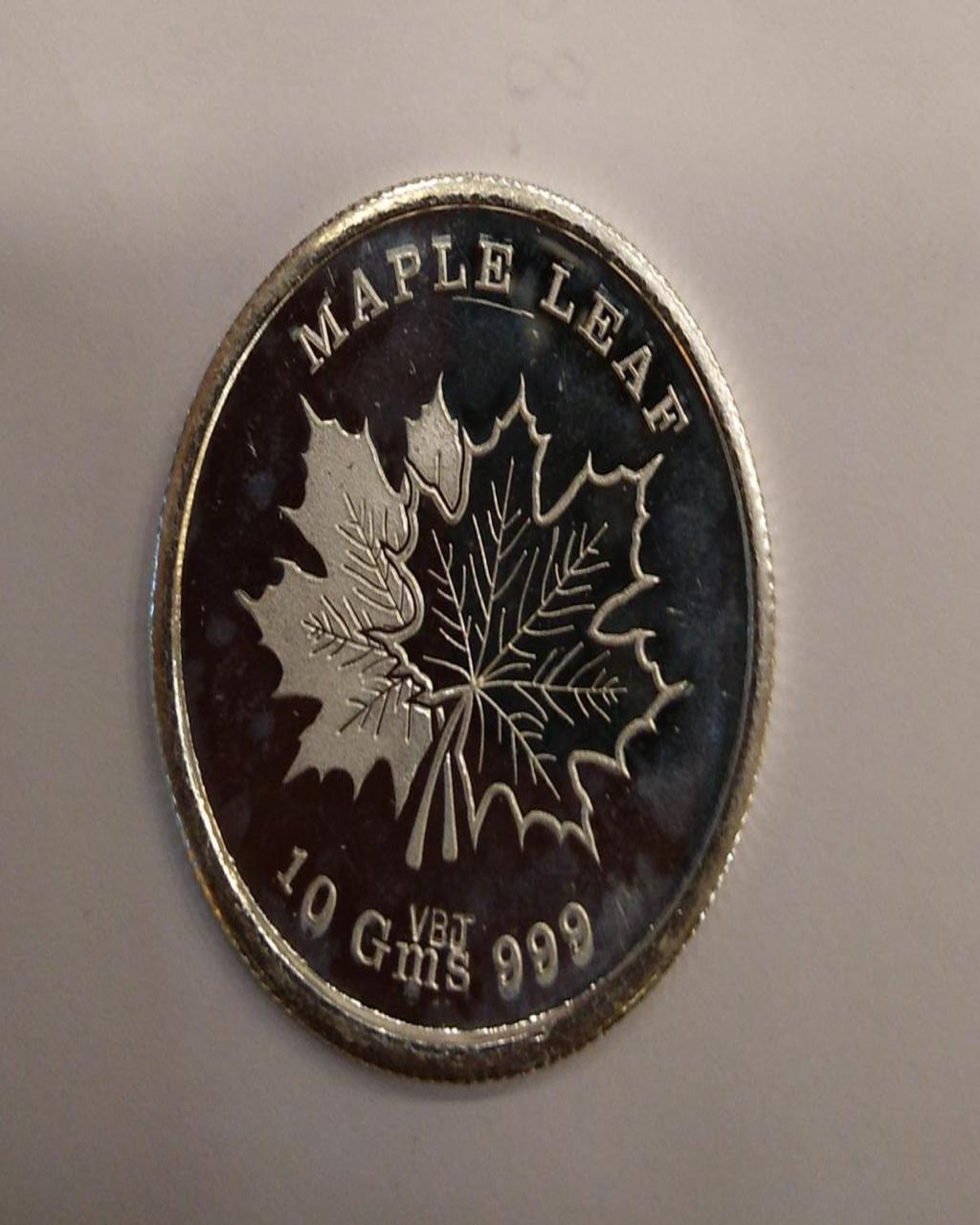 Maple Leaf Silver Coin ANGIE HOMES