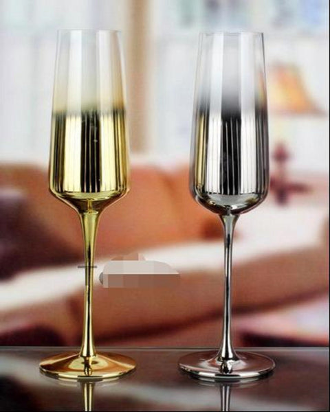 https://angiehomes.co/cdn/shop/products/deluxe-champagne-glasses-ANGIE-HOMES-1620024641_grande.jpg?v=1620024643